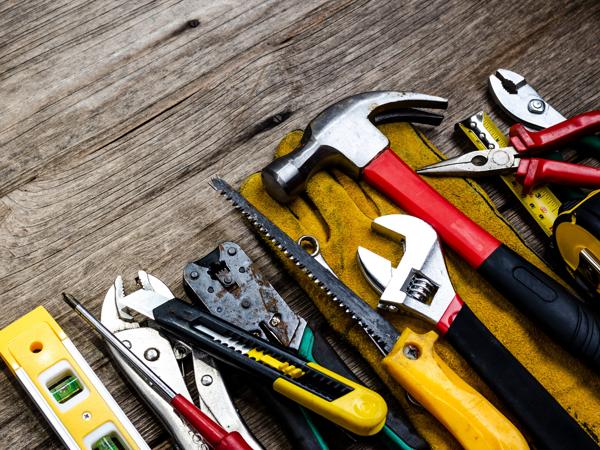 Tools on wooden background