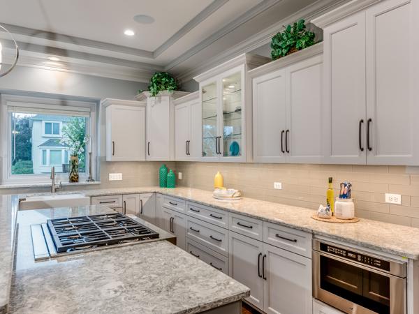 Elegant white kitchen with quartz countertops