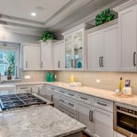 Elegant white kitchen with quartz countertops